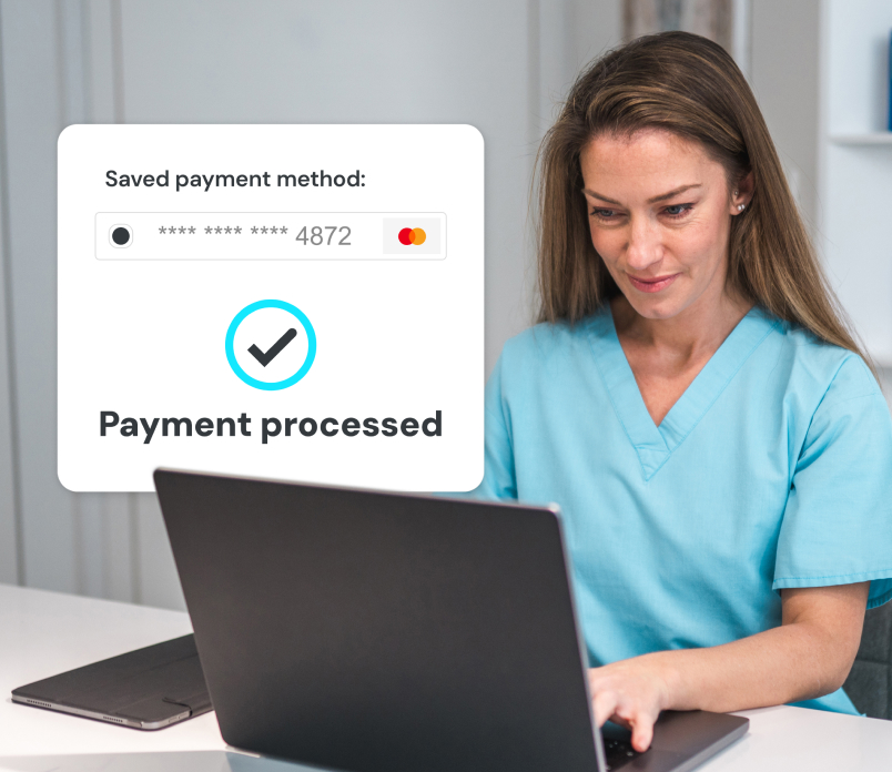 Medical worker at laptop with popup saying payment processed