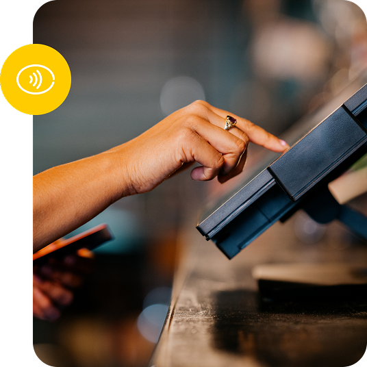 Closeup shot of a hand typing in an order on a countertop stadium POS