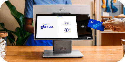 A person using a POS system to make a purchase using tap-to-pay.