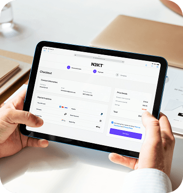A person using a tablet to complete a purchase.