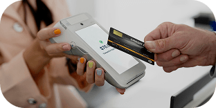 A shopper using tap-to-pay to complete an in-store purchase.