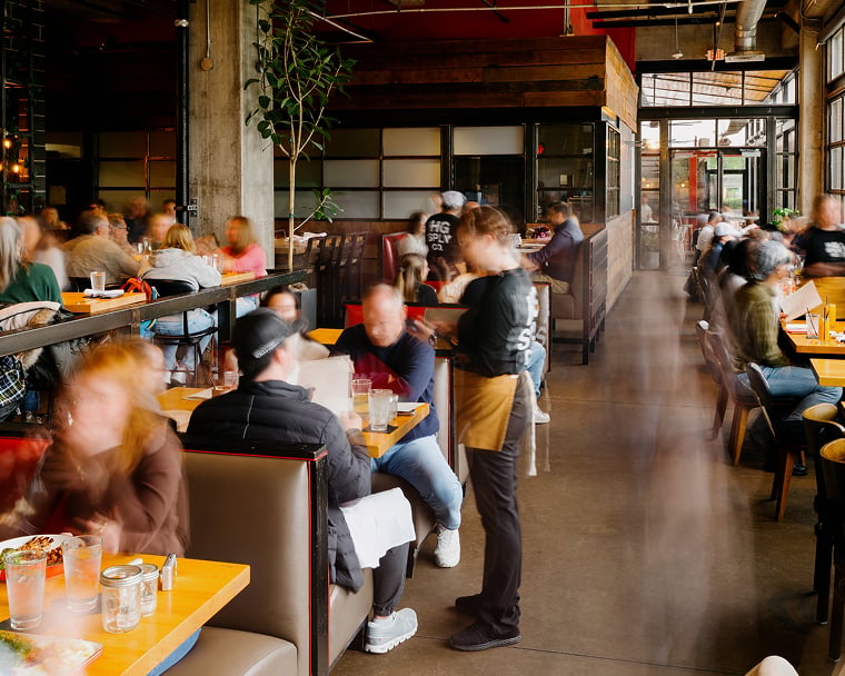Wide shot of interior of busy restaurant
