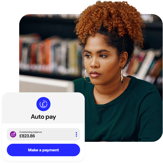 A student in a library using education payment software to pay their balance.