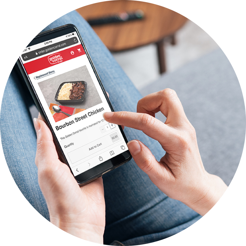 Close-up of person using mobile phone to browse and order online from Golden Corral menu