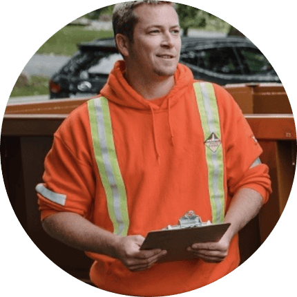 Person wearing high-visibility safety hoodie with reflective vertical striping and holding clipboard