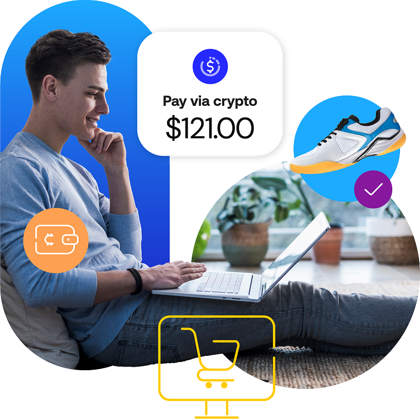Smiling man sitting on the floor with laptop with onscreen message - Pay via Crypto $121