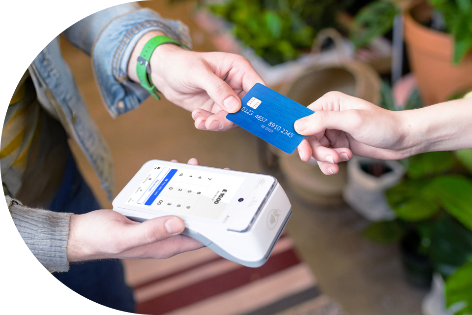 A contactless card payment is made at a card reader.