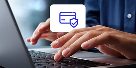 A person using a laptop to make a secure card payment.