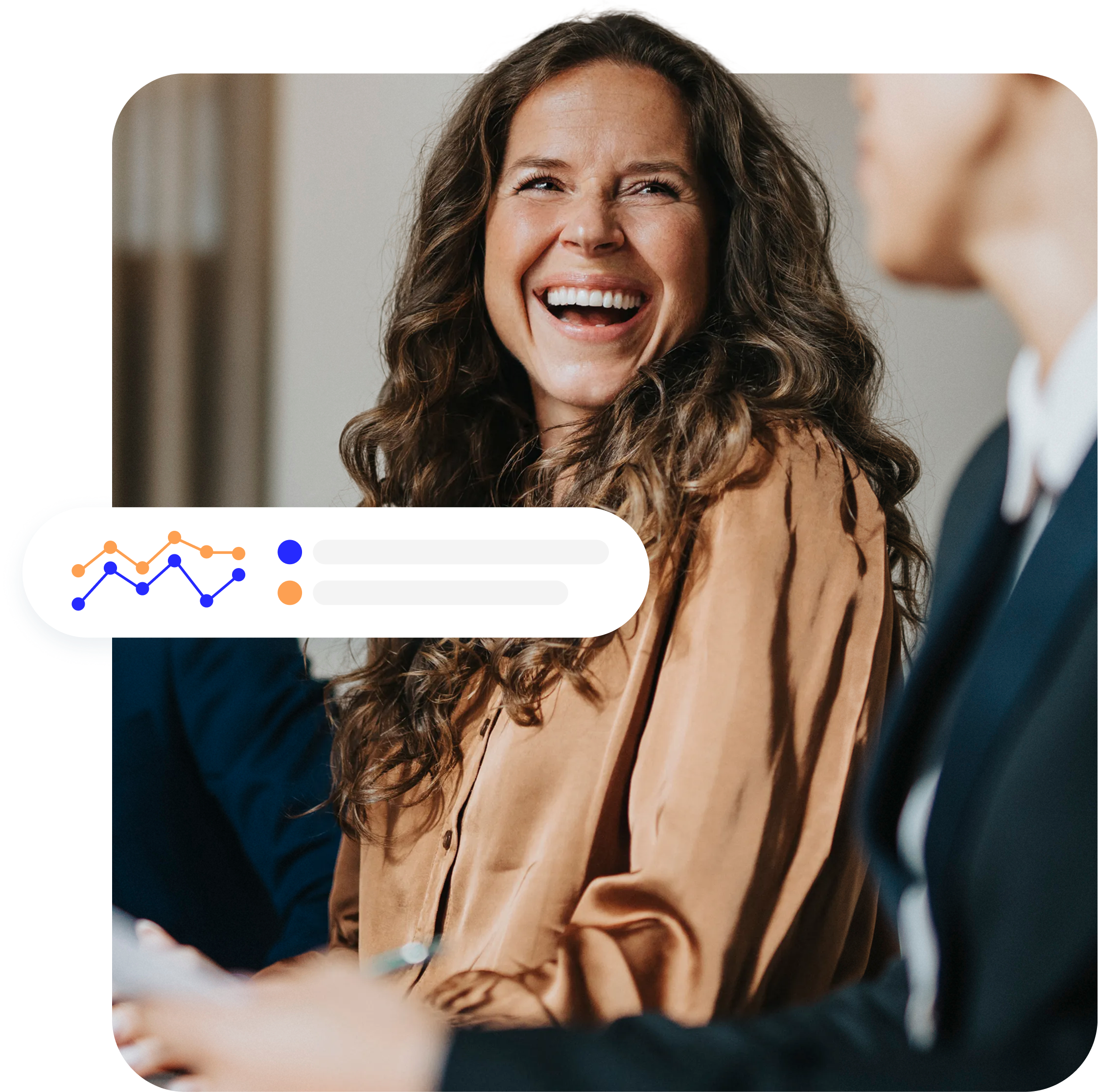 A smiling person looks on at the coworker sitting next to her, with a graph representing revenue sharing in the foreground.