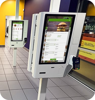 An image of a freestanding mountable point of sale displaying ordering and nutritional information for a burger.