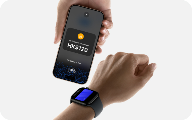 Close up of someone paying with a smart watch to an iPhone