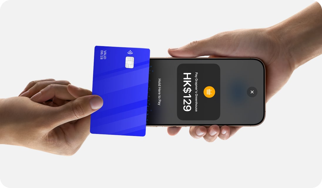 Close up of person making payment with card to iPhone