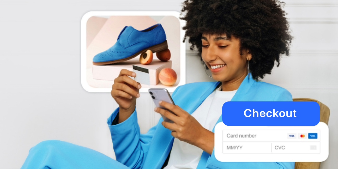 Young woman in vibrant clothes sitting in chair and making credit card payment on phone
