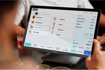 server looking at the restaurant menu options for a customer