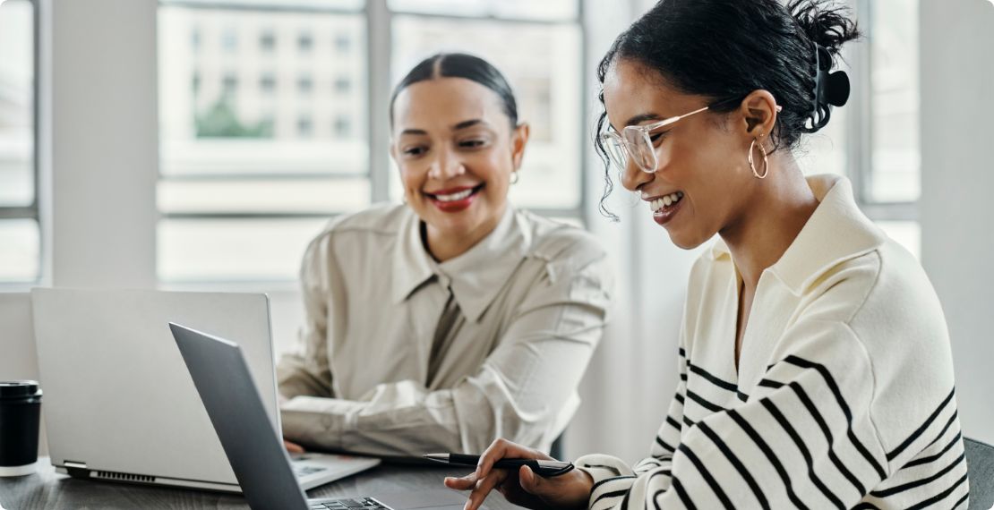 Two women on laptops 
