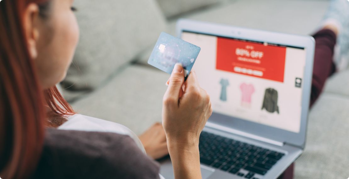 Woman using credit card for online sale