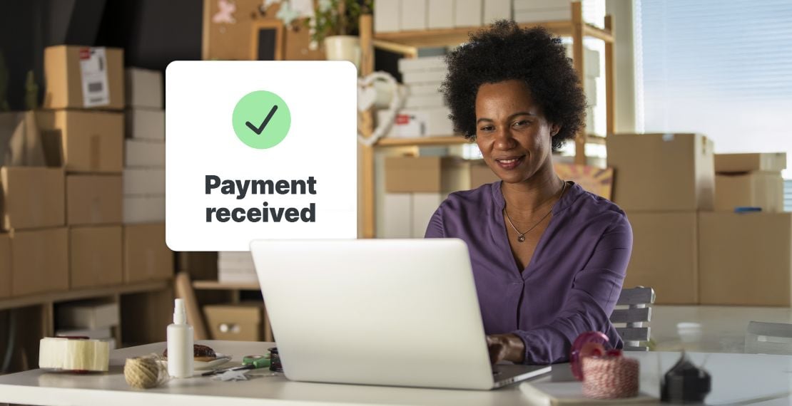 An online seller checks her website for a completed ecommerce payment