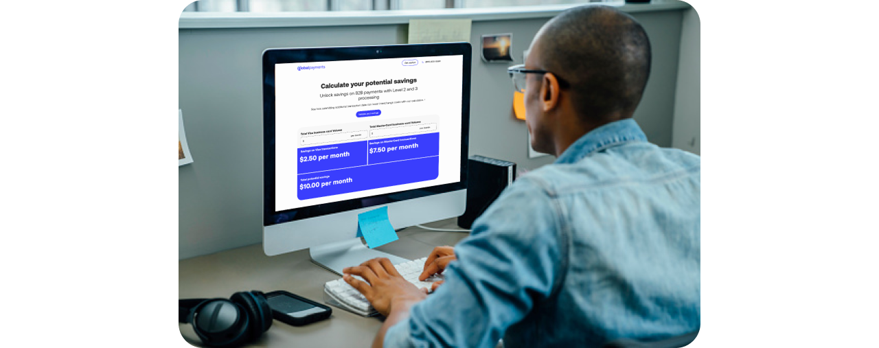 Person viewing interchange calculator while seated in front of desktop computer