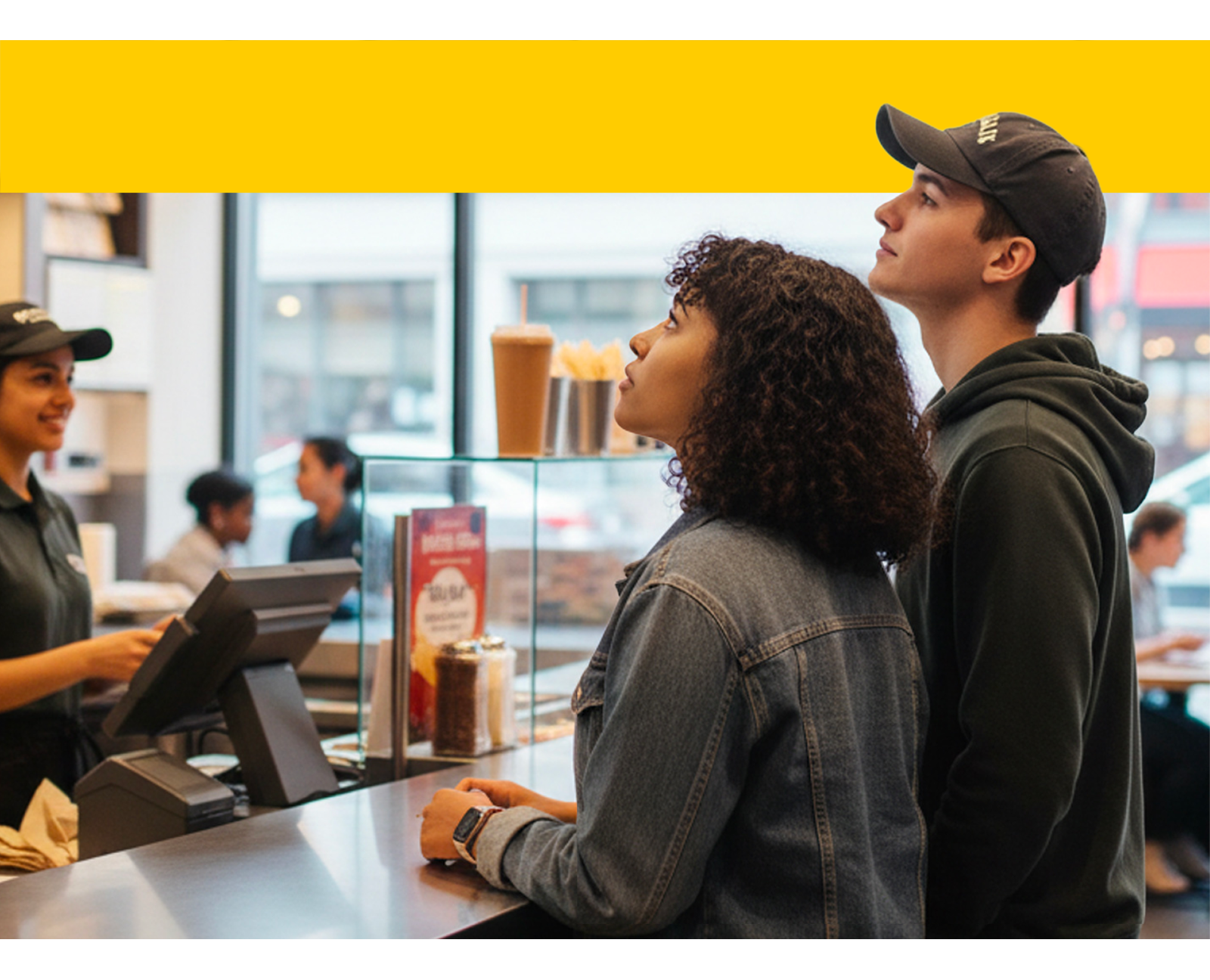 Consumers look at a menu at a quick-service restaurant with confusion.