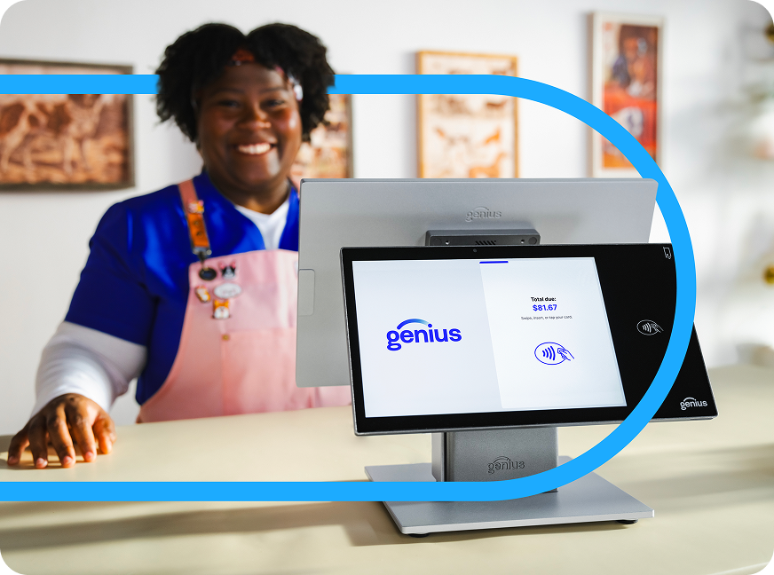 Smiling salesperson stands behind stationary Genius point of sale system