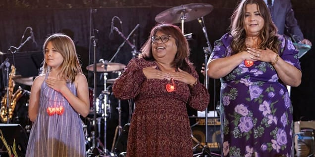 Volunteers dancing on stage at the Bakersfield Memorial Hospital Foundation fundraising event