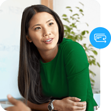 Professional woman in green leaning forward with a blue payment card icon beside her.