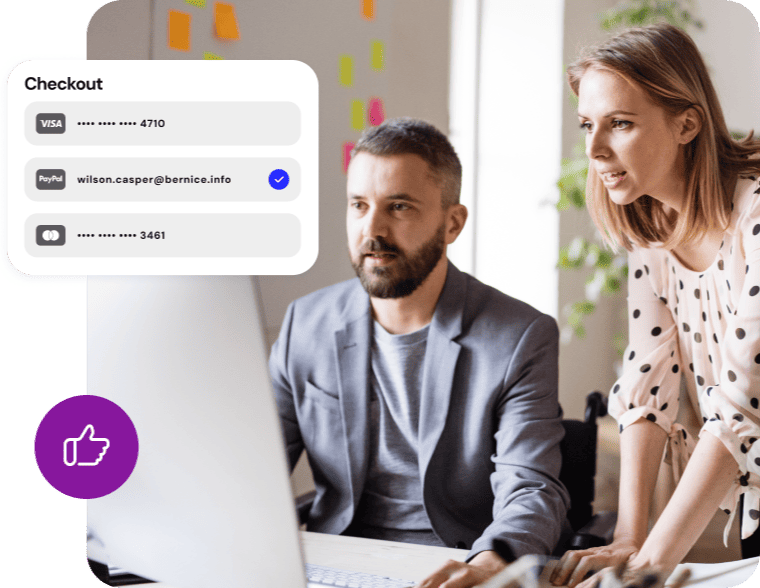 Man and woman reviewing a computer with an online checkout options popup graphic.