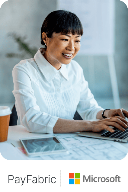 Woman working on a laptop at a desk above PayFabric and Microsoft logos.