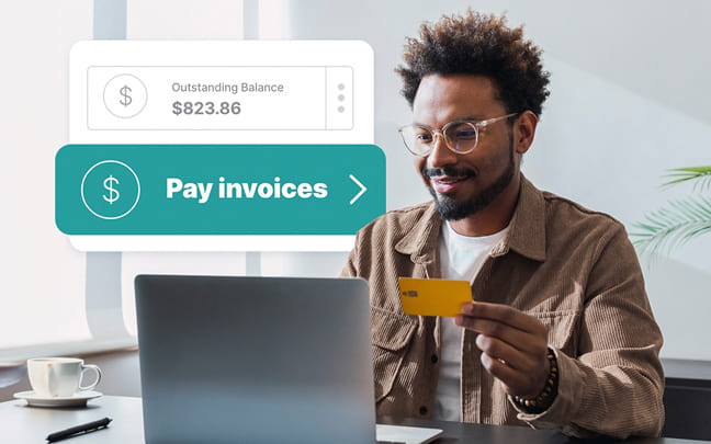 Man holding a credit card at a laptop with a "Pay invoices" graphic overlay.