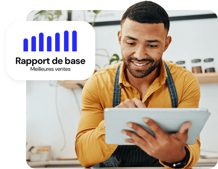 Un homme utilisant une tablette numérique avec une superposition graphique « Rapport de base Meilleures ventes »