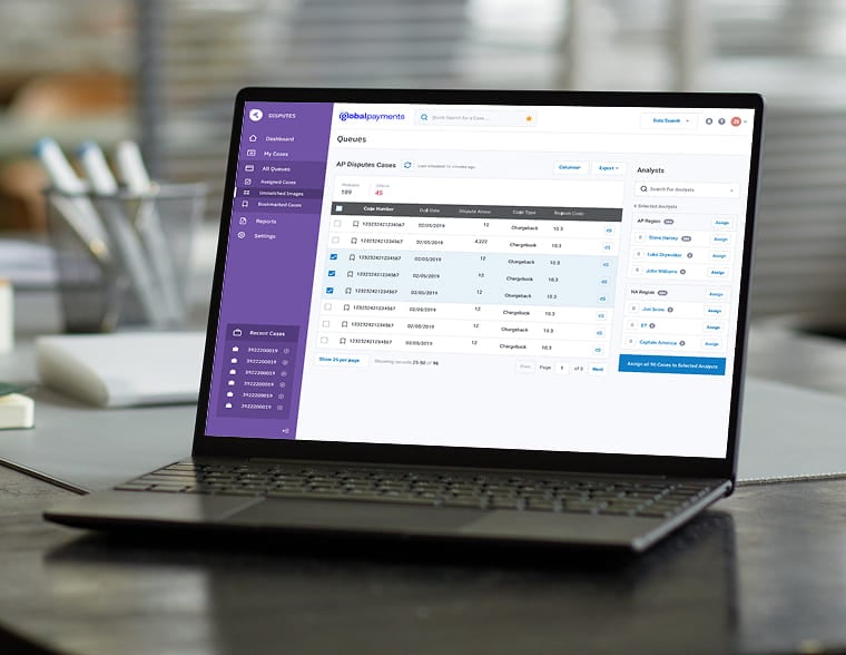 Laptop displaying a Global Payments dashboard for managing dispute case queues.