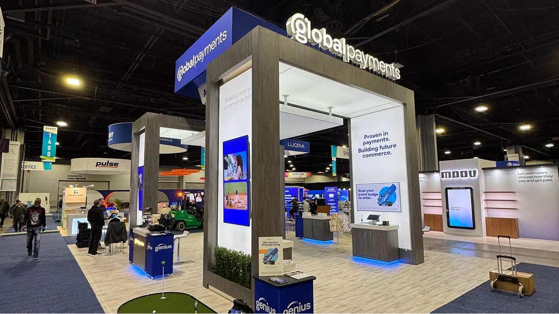 Wide shot of a Global Payments booth at a tradeshow.