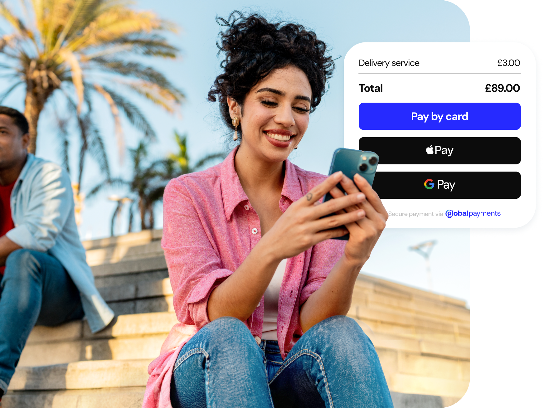 A customer is seated outdoors using a smartphone to complete a mobile checkout payment