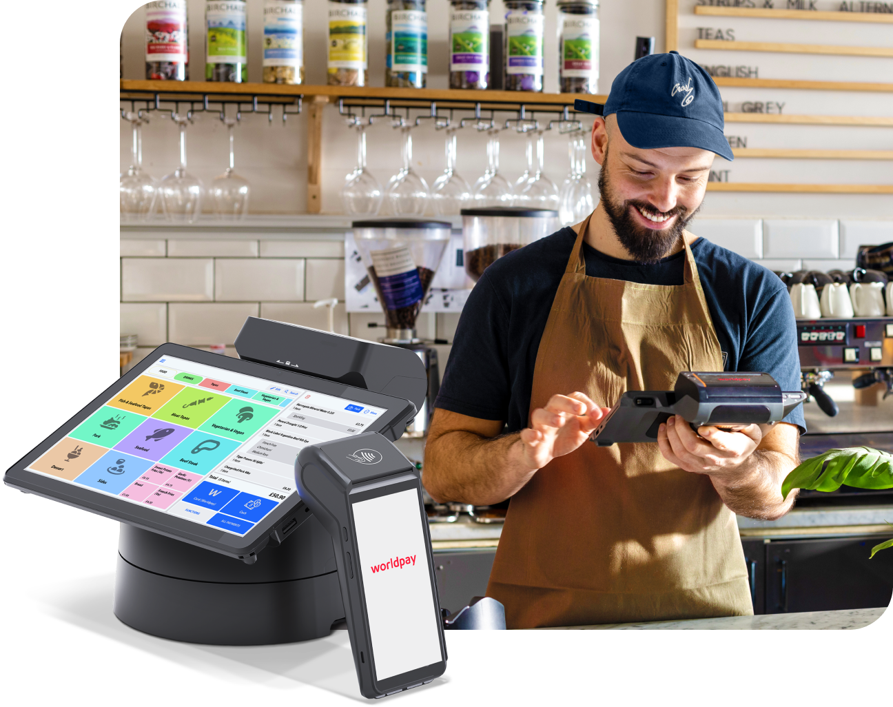 A restaurant owner stands behind a counter using a Worldpay 360 POS terminal and mobile device