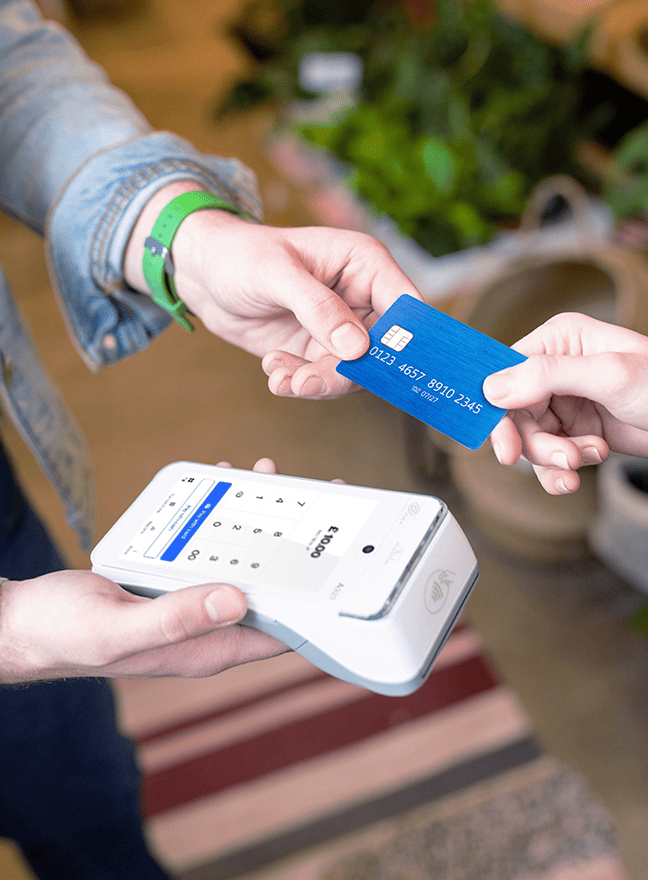 A contactless card payment is made at a card reader.