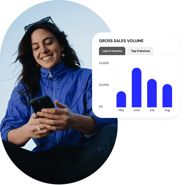 A retailer in athletic gear checks her gross sales reports from her POS on her mobile phone.