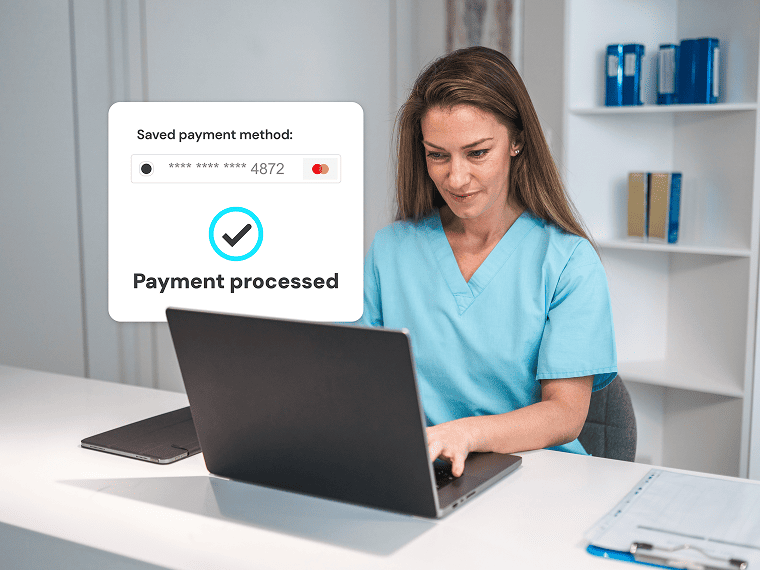 Medical worker at laptop with popup saying payment processed