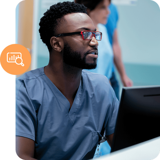 Healthcare worker in blue scrubs using a computer next to an orange chart analysis icon.