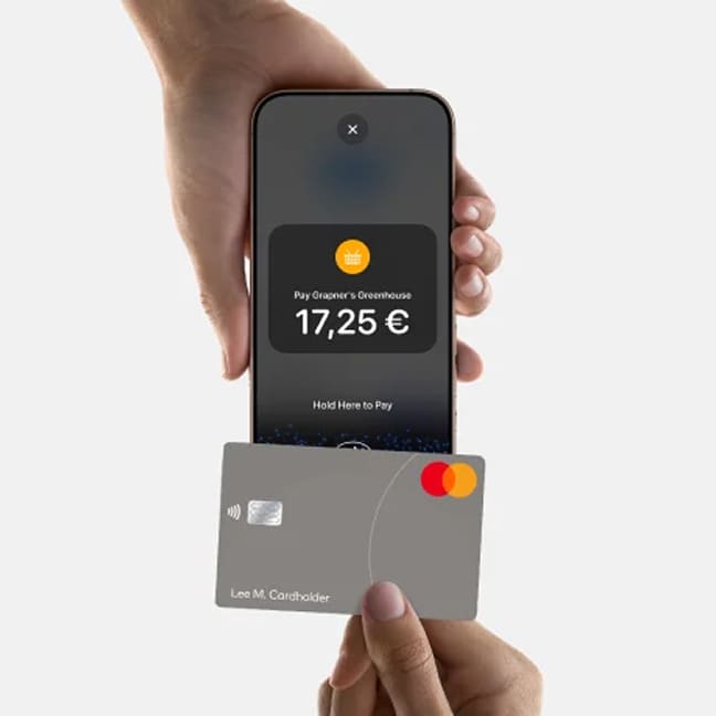 Close-up of a contactless card payment processed on an iPhone.