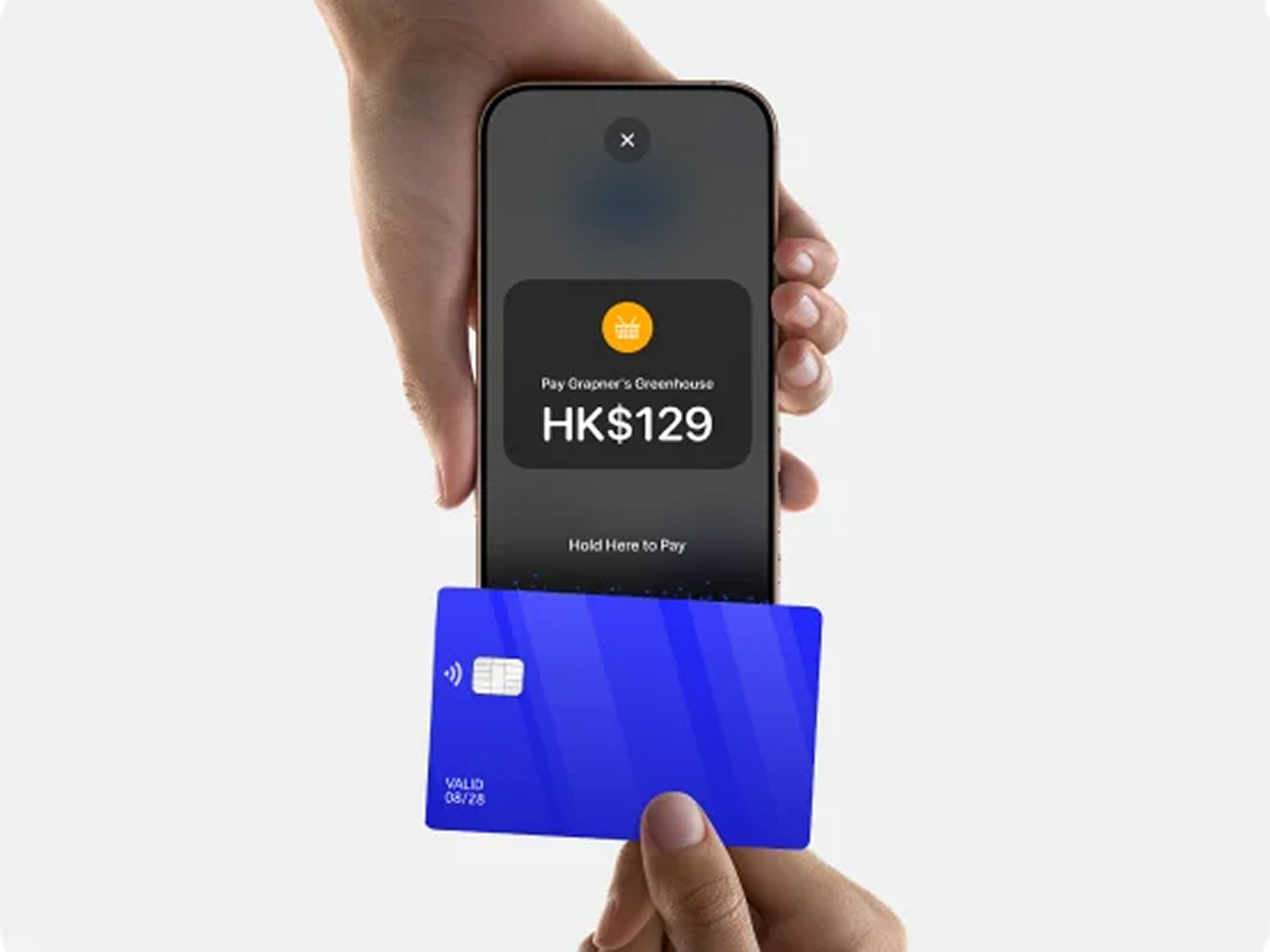 Close-up of a contactless card payment processed on an iPhone.