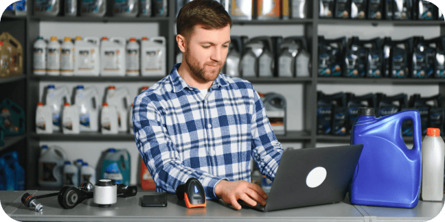 Parts dealer at a countertop with a laptop