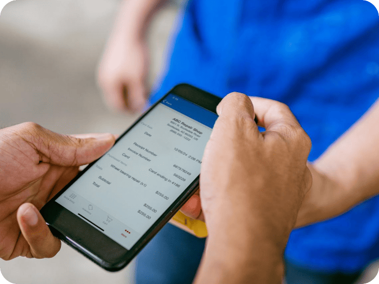 A customer looks over a digital invoice on a phone