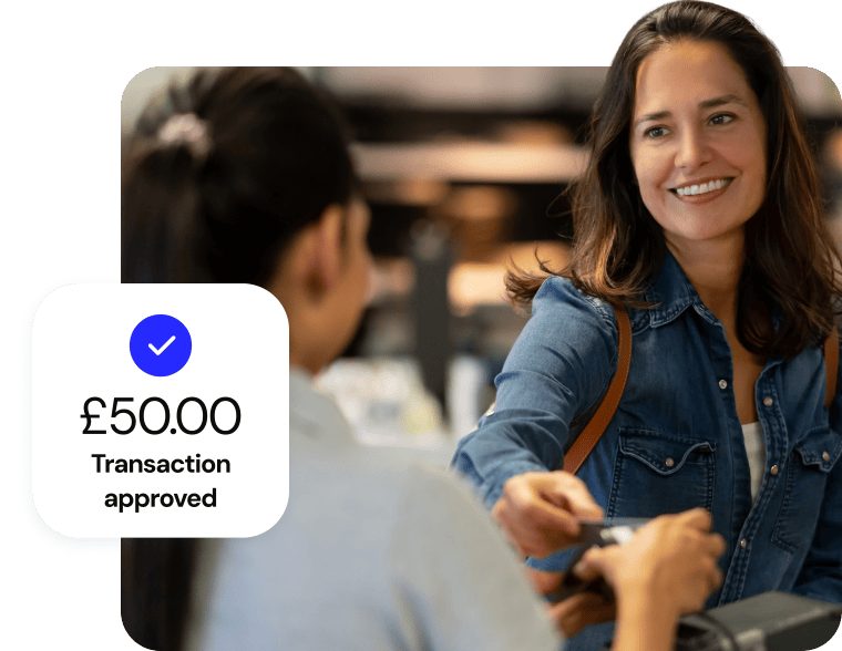 Customer smiles while completing a successful £50.00 card transaction.