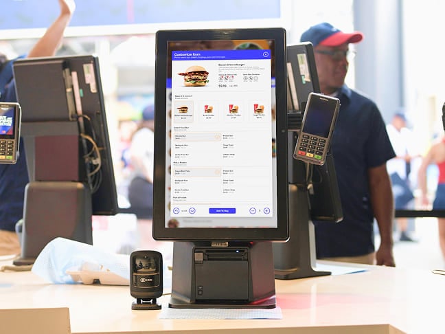 Self-service food ordering and payment kiosk at an event venue.