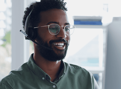 Male retail POS customer service representative speaking on a headset