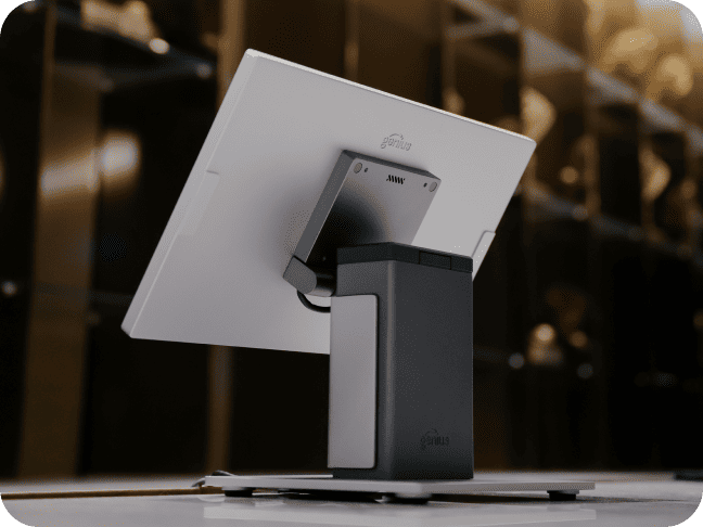 Close-up from behind of a sleek, low-profile point-of-sale hardware system on a checkout counter.