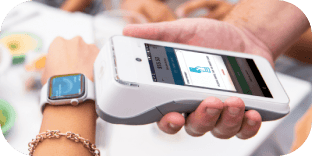 Contactless tap-to-pay transaction using a smartwatch on a white card reader.