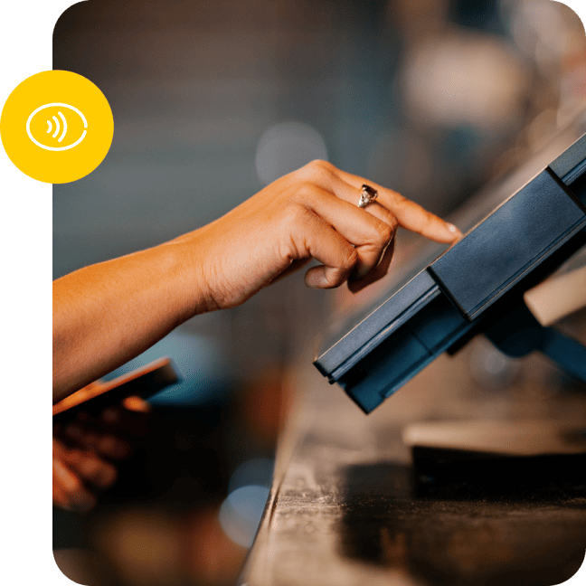 Closeup shot of a hand typing in an order on a countertop stadium POS