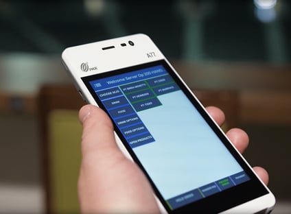 Close up shot of a smartphone showing the delivery status of a food order placed from venue seats