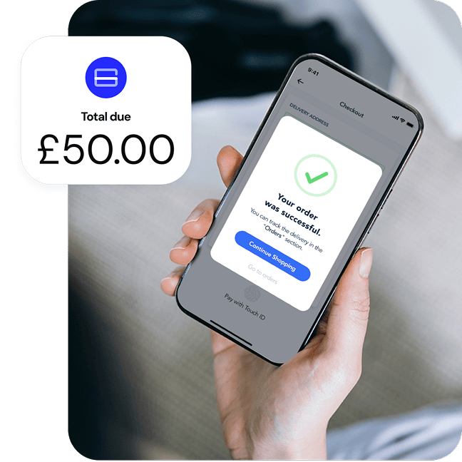 alt="A closeup of a hand holding a mobile phone with a pop up order confirmation screen, while a graphic with a monetary amount overlays the image."